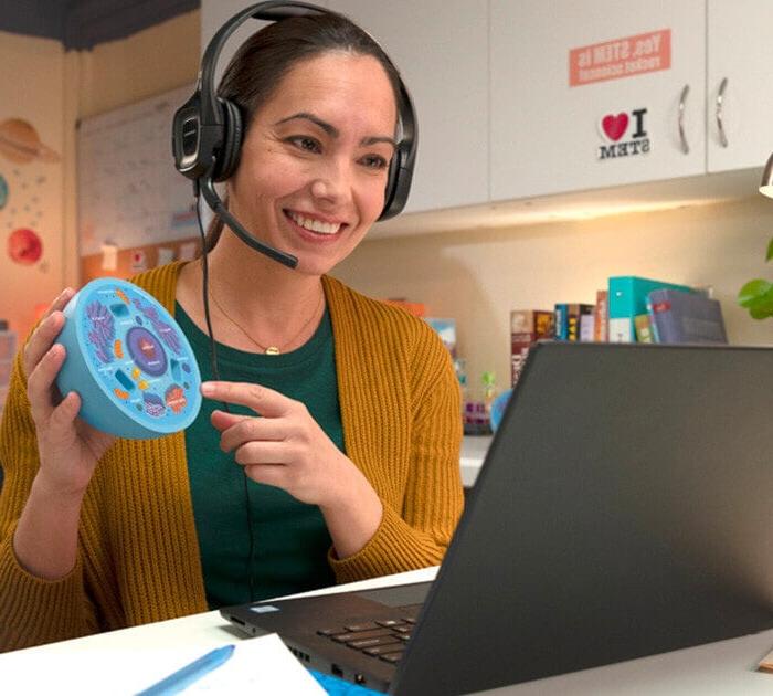 A teacher showing a model of a cell in an online class